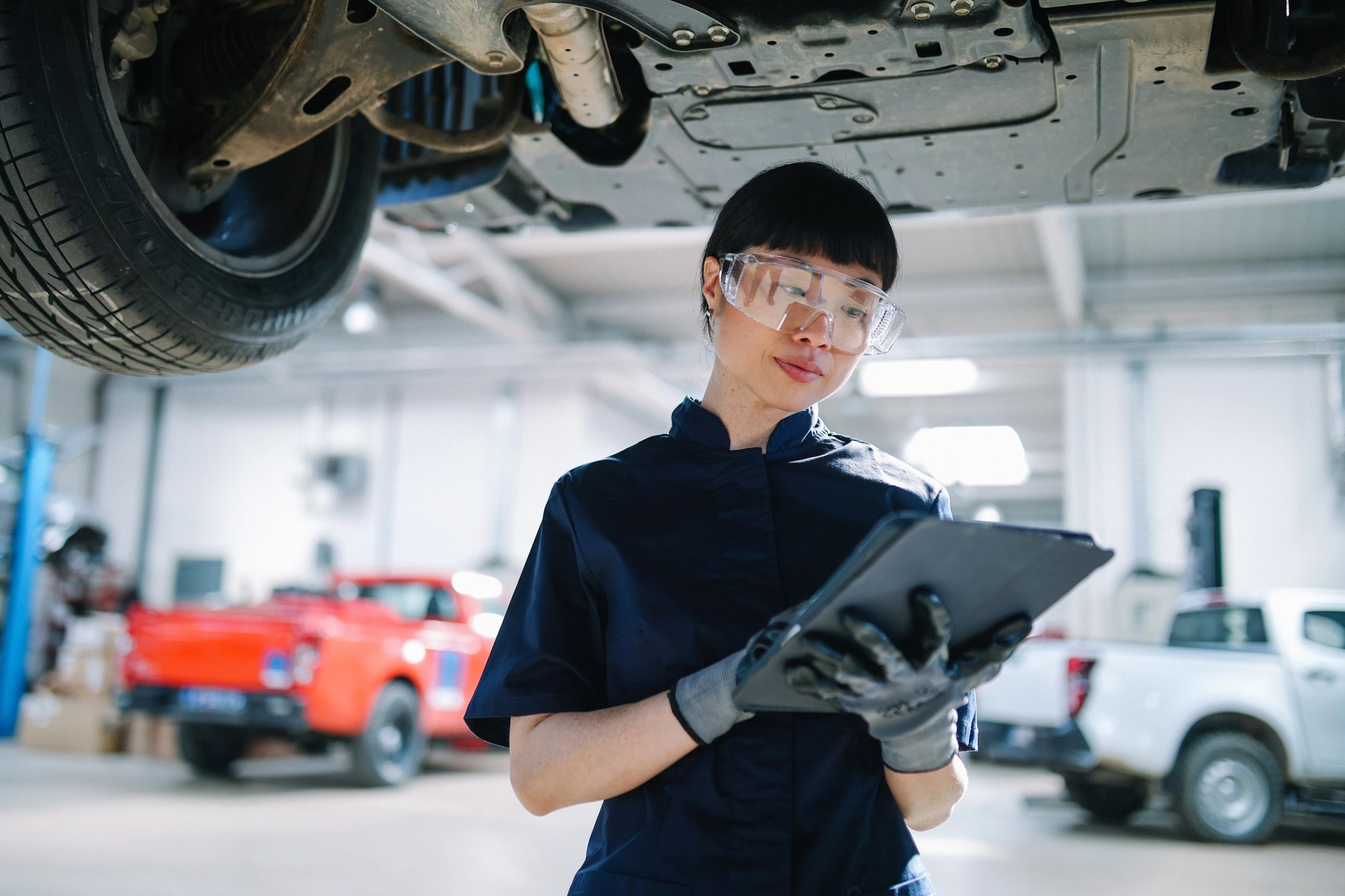 mechanic working on car engine Japanese